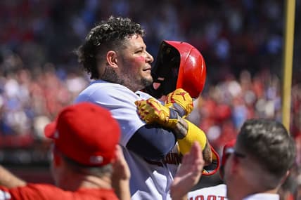 Sep 17, 2022; St. Louis, Missouri, USA;  St. Louis Cardinals catcher Yadier Molina (4) salutes the fans as he receives a standing ovation after hitting a two run home run against the Cincinnati Reds during the third inning at Busch Stadium. Mandatory Credit: Jeff Curry-USA TODAY Sports