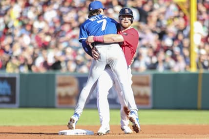 Sep 17, 2022; Boston, Massachusetts, USA;  Boston Red Sox second baseman Christian Arroyo (39) collides with Kansas City Royals shortstop Bobby Witt Jr. (7) during a double play in the second inning at Fenway Park. Mandatory Credit: Wendell Cruz-USA TODAY Sports