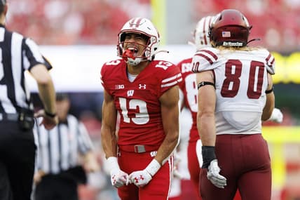 Sep 17, 2022; Madison, Wisconsin, USA;  Wisconsin Badgers wide receiver Chimere Dike (13) reacts after catching a pass during the third quarter against the New Mexico State Aggies at Camp Randall Stadium. Mandatory Credit: Jeff Hanisch-USA TODAY Sports