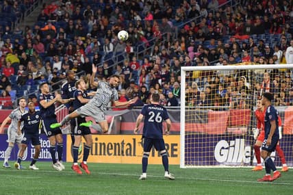 Sep 17, 2022; Foxborough, Massachusetts, USA; CF Montreal defender Rudy Camacho (4) makes a leaping play for the ball  during the first half of a match against against the New England Revolution at Gillette Stadium. Mandatory Credit: Eric Canha-USA TODAY Sports