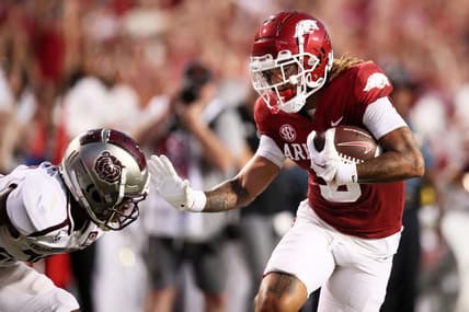 Sep 17, 2022; Fayetteville, Arkansas, USA; Arkansas Razorbacks wide receiver Jadon Haselwood (9) pushes off of a Missouri State Bears defender in the second quarter as he runs after a catch for a touchdown at Donald W. Reynolds Razorback Stadium. Mandatory Credit: Nelson Chenault-USA TODAY Sports