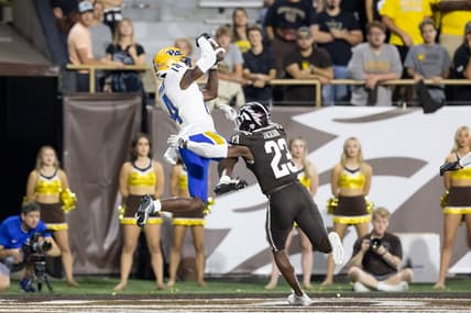Sep 17, 2022; Kalamazoo, Michigan, USA; Pittsburgh Panthers wide receiver Konata Mumpfield (14) catches a touchdown pass against Western Michigan Broncos cornerback Dorian Jackson (23) in the fourth quarter at Waldo Stadium. Mandatory Credit: Kimberly Moss-USA TODAY Sports