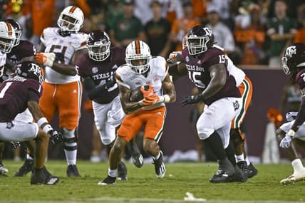 Sep 17, 2022; College Station, Texas, USA; Miami Hurricanes running back Jaylan Knighton (4) runs with the ball against the Texas A&M Aggies during the second quarter at Kyle Field. Mandatory Credit: Jerome Miron-USA TODAY Sports