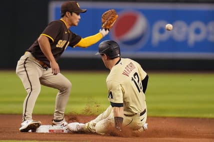 Sep 17, 2022; Phoenix, Arizona, USA; Arizona Diamondbacks' Daulton Varsho (12) slides in safely to second after hitting a double as San Diego Padres infielder Ha-Seong Kim (7) catches the ball at Chase Field. Mandatory Credit: Joe Rondone-Arizona Republic

Mlb Padres At D Backs