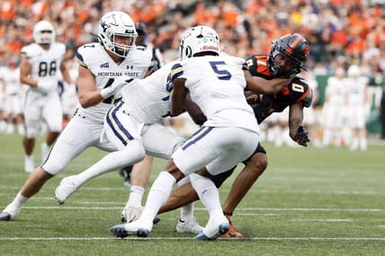 Sep 17, 2022; Portland, Oregon, USA; Oregon State Beavers wide receiver Tre'Shaun Harrison (0) is grabbed by Montana State Bobcats safety Jeffrey Manning Jr. (5) during the first half at Providence Park. Mandatory Credit: Soobum Im-USA TODAY Sports