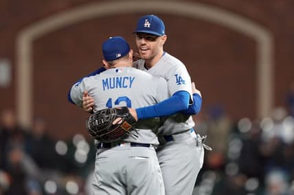 Sep 17, 2022; San Francisco, California, USA; Los Angeles Dodgers third baseman Max Muncy (13) and first baseman Freddie Freeman (5, right) celebrate after defeating the San Francisco Giants at Oracle Park. Mandatory Credit: Darren Yamashita-USA TODAY Sports