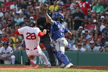 Sep 18, 2022; Boston, Massachusetts, USA; Boston Red Sox designated hitter JD Martinez (28) slides past Kansas City Royals catcher MJ Melendez (1) during the third inning against the Kansas City Royals at Fenway Park. Mandatory Credit: Paul Rutherford-USA TODAY Sports
