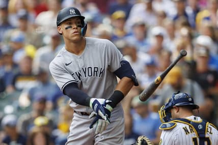 Sep 18, 2022; Milwaukee, Wisconsin, USA;  New York Yankees center fielder Aaron Judge (99) tosses his bat away after drawing a walk during the fifth inning against the Milwaukee Brewers at American Family Field. Mandatory Credit: Jeff Hanisch-USA TODAY Sports