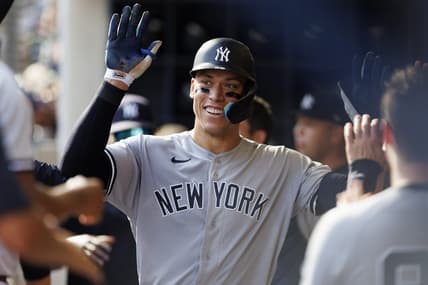 Sep 18, 2022; Milwaukee, Wisconsin, USA;  New York Yankees center fielder Aaron Judge (99) celebrates with teammates in the dugout after hitting a home run during the seventh inning against the Milwaukee Brewers at American Family Field. Mandatory Credit: Jeff Hanisch-USA TODAY Sports