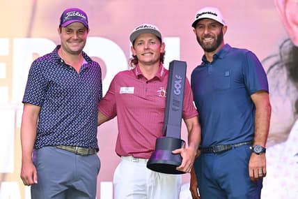 Sep 18, 2022; Chicago, Illinois, USA; Cameron Smith holds the winning trophy while posing with runner up Peter Uihlein, far left, and third place finisher Dustin Johnson after the final round of the Invitational Chicago LIV Golf tournament at Rich Harvest Farms. Mandatory Credit: Jamie Sabau-USA TODAY Sports