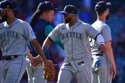 Sep 19, 2022; Anaheim, California, USA; Seattle Mariners designated hitter Carlos Santana (41) celebrates the victory against the Los Angeles Angels at Angel Stadium. Mandatory Credit: Gary A. Vasquez-USA TODAY Sports