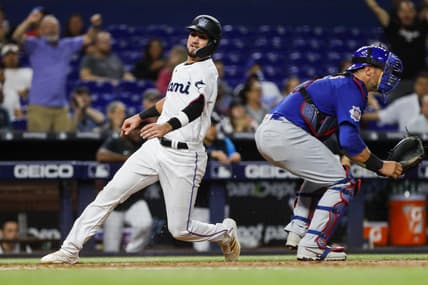 Sep 19, 2022; Miami, Florida, USA; Miami Marlins third baseman Jordan Groshans (65) scores a run in the fourth inning against the Chicago Cubs at loanDepot Park. Mandatory Credit: Sam Navarro-USA TODAY Sports