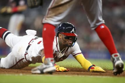 Sep 19, 2022; Atlanta, Georgia, USA; Atlanta Braves right fielder Ronald Acuna Jr. (13) slides in safely at third base against the Washington Nationals in the fifth inning at Truist Park. Mandatory Credit: Brett Davis-USA TODAY Sports