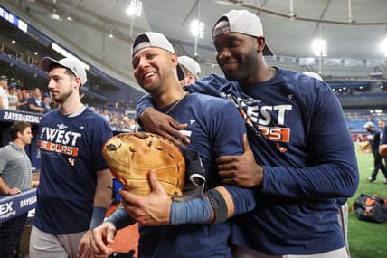 Sep 19, 2022; St. Petersburg, Florida, USA;  Houston Astros first baseman Yuli Gurriel (10) and left fielder Yordan Alvarez (44) celebrate after winning the American League West division at Tropicana Field. Mandatory Credit: Nathan Ray Seebeck-USA TODAY Sports