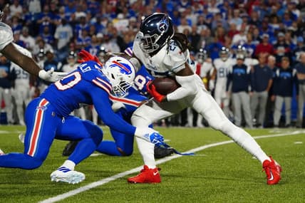 Sep 19, 2022; Orchard Park, New York, USA; Buffalo Bills linebacker Von Miller (40) tackles Tennesse Titans running back Derrick Henry (22) during the first half at Highmark Stadium. Mandatory Credit: Gregory Fisher-USA TODAY Sports