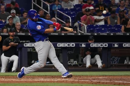 Sep 20, 2022; Miami, Florida, USA; Chicago Cubs third baseman David Bote (13) connects for a solo home run in the seventh inning against the Miami Marlins at loanDepot park. Mandatory Credit: Jasen Vinlove-USA TODAY Sports