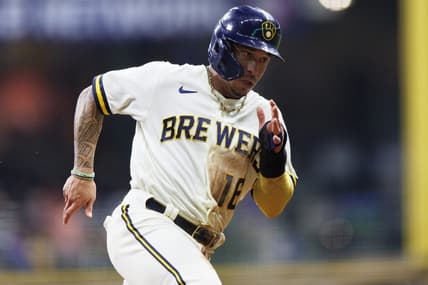 Sep 20, 2022; Milwaukee, Wisconsin, USA;  Milwaukee Brewers second baseman Kolten Wong (16) rounds third base before scoring a run during the second inning against the New York Mets at American Family Field. Mandatory Credit: Jeff Hanisch-USA TODAY Sports