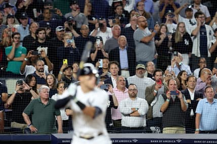 Sep 20, 2022; Bronx, New York, USA; Fans watch as New York Yankees right fielder Aaron Judge (99) bats against the Pittsburgh Pirates during the sixth inning at Yankee Stadium. Mandatory Credit: Brad Penner-USA TODAY Sports