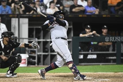 Sep 20, 2022; Chicago, Illinois, USA;  Cleveland Guardians first baseman Josh Naylor (22) hits an RBI single during the tenth inning against the Chicago White Sox at Guaranteed Rate Field. Mandatory Credit: Matt Marton-USA TODAY Sports