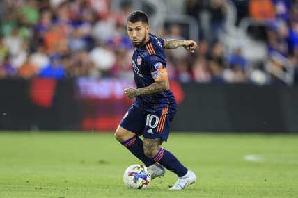 Sep 21, 2022; Cincinnati, OH, USA;  FC Cincinnati midfielder Luciano Acosta (10) carries the ball against Club Deportivo Guadalajara in the second half at TQL Stadium. Mandatory Credit: Aaron Doster-USA TODAY Sports