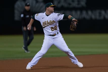 Sep 21, 2022; Oakland, California, USA;  Oakland Athletics third baseman Sheldon Neuse (26) throws the baseball during the seventh inning against the Seattle Mariners at RingCentral Coliseum. Mandatory Credit: Stan Szeto-USA TODAY Sports
