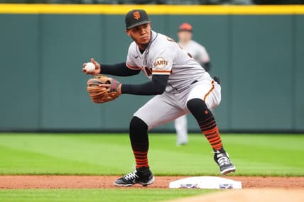 Sep 22, 2022; Denver, Colorado, USA; San Francisco Giants second baseman Thairo Estrada (39) fields the ball in the first inning against the Colorado Rockies at Coors Field. Mandatory Credit: Ron Chenoy-USA TODAY Sports