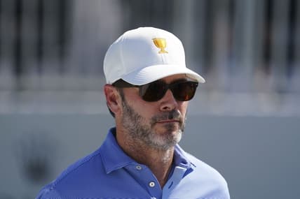 Sep 22, 2022; Charlotte, North Carolina, USA; Race car driver Jimmie Johnson stands on the eighth tee during the foursomes match play of the Presidents Cup golf tournament at Quail Hollow Club. Mandatory Credit: Peter Casey-USA TODAY Sports