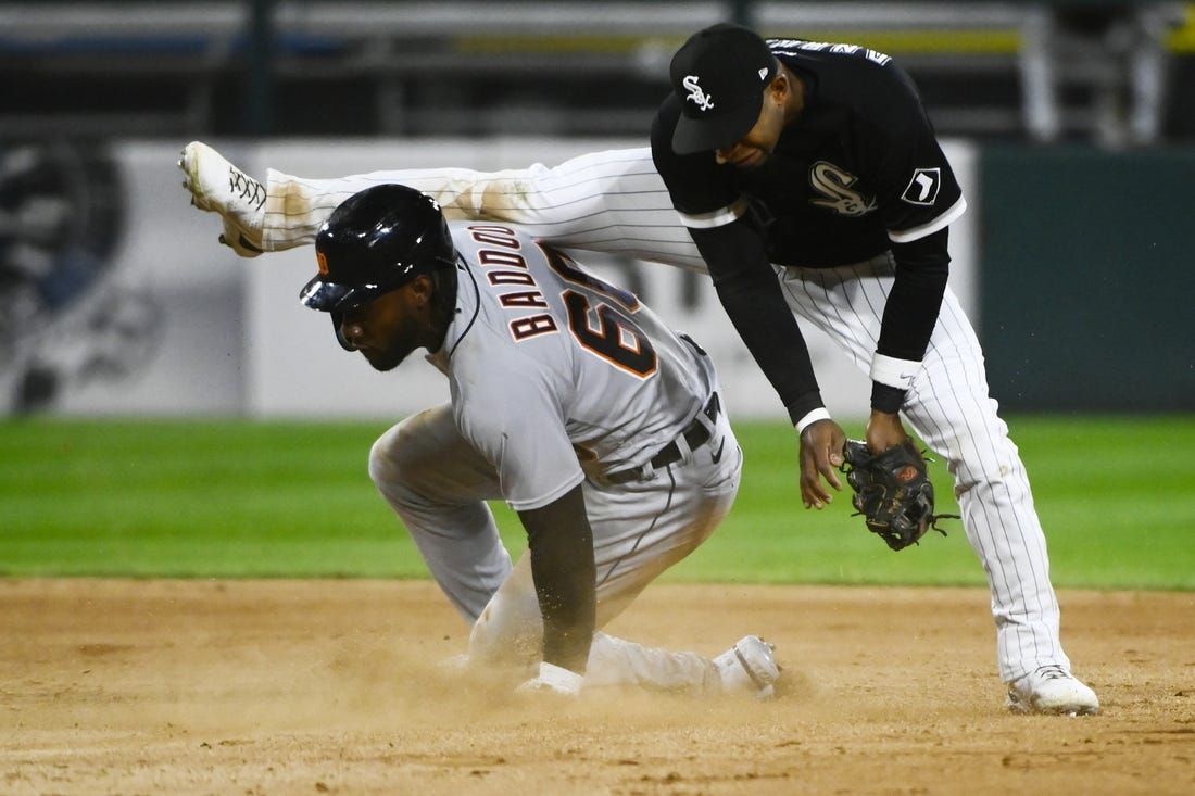 Sep 23, 2022; Chicago, Illinois, USA; Detroit Tigers left fielder Akil Baddoo (60) steals second base under Chicago White Sox shortstop Elvis Andrus (1) during the seventh inning at Guaranteed Rate Field. Mandatory Credit: Matt Marton-USA TODAY Sports
