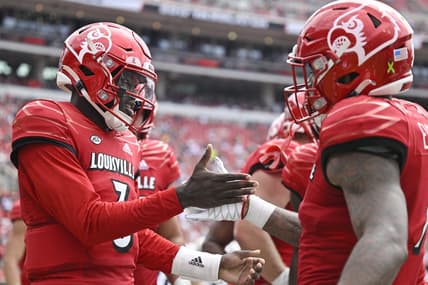 Sep 24, 2022; Louisville, Kentucky, USA; Louisville Cardinals quarterback Malik Cunningham (3) celebrates a touchdown with teammates during the second quarter against the South Florida Bulls at Cardinal Stadium. Mandatory Credit: Jamie Rhodes-USA TODAY Sports