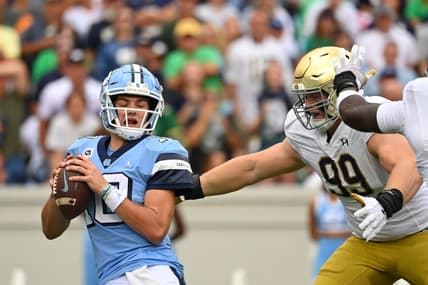 Sep 24, 2022; Chapel Hill, North Carolina, USA; North Carolina Tar Heels quarterback Drake Maye (10) is sacked by Notre Dame Fighting Irish defensive lineman Rylie Mills (99) in the first quarter at Kenan Memorial Stadium. Mandatory Credit: Bob Donnan-USA TODAY Sports