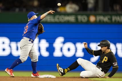 Sep 24, 2022; Pittsburgh, Pennsylvania, USA; Chicago Cubs second baseman Esteban Quiroz (43) throws to first base after forcing Pittsburgh Pirates center fielder Bryan Reynolds (10) during the fifth inning at PNC Park. Mandatory Credit: Scott Galvin-USA TODAY Sports