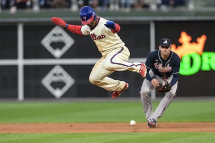 Sep 24, 2022; Philadelphia, Pennsylvania, USA;  Philadelphia Phillies second baseman Jean Segura (2) jumps to avoid a ball hit by Philadelphia Phillies shortstop Bryson Stott (not pictured) during the seventh inning of the game against the Atlanta Braves at Citizens Bank Park. The Braves won with a score of 6-3. Mandatory Credit: John Geliebter-USA TODAY Sports