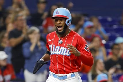 Sep 24, 2022; Miami, Florida, USA; Miami Marlins center fielder Bryan De La Cruz (14) scores after a double by shortstop Miguel Rojas (not pictured) during the sixth inning against the Washington Nationals at loanDepot Park. Mandatory Credit: Sam Navarro-USA TODAY Sports