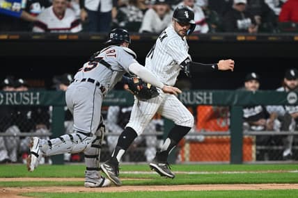 Sep 24, 2022; Chicago, Illinois, USA;  Chicago White Sox outfielder AJ Pollock (18) is tagged out along the third base line by Detroit Tigers catcher Tucker Barnhart (15) after trying to score on an infield hit in the fourth inning at Guaranteed Rate Field. Mandatory Credit: Jamie Sabau-USA TODAY Sports