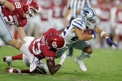 Oklahoma's DaShaun White (23) brings down Deuce Vaughn (22) during a college football game between the University of Oklahoma Sooners (OU) and the Kansas State Wildcats at Gaylord Family - Oklahoma Memorial Stadium in Norman, Okla., Saturday, Sept. 24, 2022.

Ou Vs Kansas State