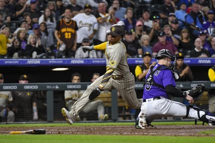 Sep 24, 2022; Denver, Colorado, USA; San Diego Padres left fielder Jurickson Profar (10) gets past Colorado Rockies catcher Brian Serven (6) for a score during the seventh inning at Coors Field. Mandatory Credit: John Leyba-USA TODAY Sports