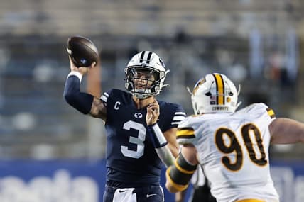 Sep 24, 2022; Provo, Utah, USA; Brigham Young Cougars quarterback Jaren Hall (3) passes the ball against Wyoming Cowboys nose tackle Gavin Meyer (90) in the second quarter at LaVell Edwards Stadium. Mandatory Credit: Rob Gray-USA TODAY Sports
