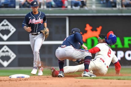 Sep 25, 2022; Philadelphia, Pennsylvania, USA; Atlanta Braves shortstop Dansby Swanson (7) tags out Philadelphia Phillies second baseman Jean Segura (2) trying to steal second base during the first inning at Citizens Bank Park. Mandatory Credit: Eric Hartline-USA TODAY Sports