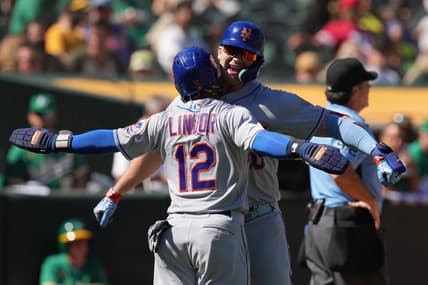 Sep 25, 2022; Oakland, California, USA; New York Mets designated hitter Pete Alonso (right) celebrates with shortstop Francisco Lindor (12) after hitting a home run against the Oakland Athletics during the fourth inning at RingCentral Coliseum. Mandatory Credit: Darren Yamashita-USA TODAY Sports