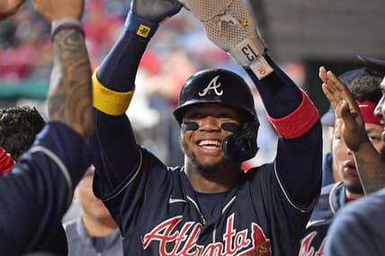 Sep 25, 2022; Philadelphia, Pennsylvania, USA; Atlanta Braves right fielder Ronald Acuna Jr. (13) celebrates in the dugout against the Philadelphia Phillies during the eleventh inning at Citizens Bank Park. Mandatory Credit: Eric Hartline-USA TODAY Sports