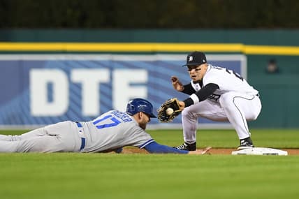 Sep 28, 2022; Detroit, Michigan, USA; Detroit Tigers shortstop Javier Baez (28) (right) takes a throw from relief pitcher Jose Cisnero (not pictured) on a pickoff attempt against Kansas City Royals third baseman Hunter Dozier (17) in the sixth inning at Comerica Park. Mandatory Credit: Lon Horwedel-USA TODAY Sports