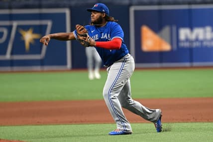 Sep 23, 2022; St. Petersburg, Florida, USA;  Toronto Blue Jays first baseman Vladimir Guerrero Jr. (27) throws to third base in the eighth inning against the Tampa Bay Rays at Tropicana Field. Mandatory Credit: Jonathan Dyer-USA TODAY Sports