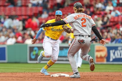 Sep 29, 2022; Boston, Massachusetts, USA; Boston Red Sox shortstop Xander Bogaerts (2) beats Baltimore Orioles third baseman Gunnar Henderson (2) to second base for an out during the second inning at Fenway Park. Mandatory Credit: Paul Rutherford-USA TODAY Sports