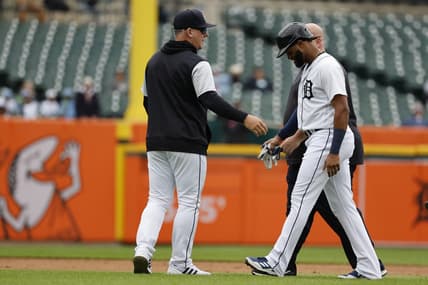 Sep 29, 2022; Detroit, Michigan, USA;  Detroit Tigers right fielder Willi Castro (9) walks off the field with Detroit Tigers manager A.J. Hinch (14) after an injury in the fourth inning against the Kansas City Royals at Comerica Park. Mandatory Credit: Rick Osentoski-USA TODAY Sports