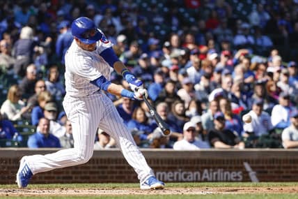 Sep 29, 2022; Chicago, Illinois, USA; Chicago Cubs third baseman Patrick Wisdom (16) hits an RBI double against the Philadelphia Phillies during the first inning at Wrigley Field. Mandatory Credit: Kamil Krzaczynski-USA TODAY Sports