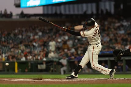 Sep 29, 2022; San Francisco, California, USA;  San Francisco Giants center fielder Mike Yastrzemski (5) hits a single during the first inning against the Colorado Rockies at Oracle Park. Mandatory Credit: Stan Szeto-USA TODAY Sports