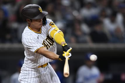 Sep 29, 2022; San Diego, California, USA; San Diego Padres shortstop Ha-Seong Kim (7) hits a single against the Los Angeles Dodgers during the eighth inning at Petco Park. Mandatory Credit: Orlando Ramirez-USA TODAY Sports