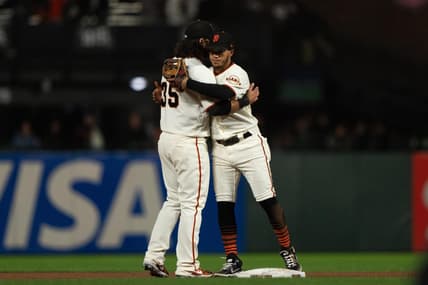 Sep 29, 2022; San Francisco, California, USA;  San Francisco Giants shortstop Brandon Crawford (35) celebrates with second baseman Thairo Estrada (39) after defeating the Colorado Rockies at Oracle Park. Mandatory Credit: Stan Szeto-USA TODAY Sports