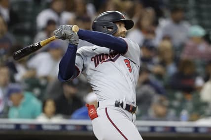 Sep 30, 2022; Detroit, Michigan, USA; Minnesota Twins left fielder Jake Cave (8) hits an RBI single in the fourth inning against the Detroit Tigers at Comerica Park. Mandatory Credit: Rick Osentoski-USA TODAY Sports