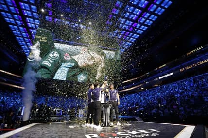 Aug 25, 2019; Detroit, MI, USA; Team Liquid celebrate and lift the trophy after winning the LCS Summer Finals event against Cloud9 at Little Caesars Arena. Mandatory Credit: Raj Mehta-USA TODAY Sports